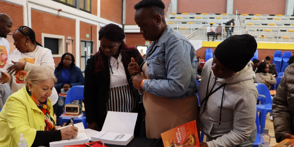 Prof Linda Richter signs copies of her book for 3 generations of Birth to 30 study participants at Jabulani Soweto